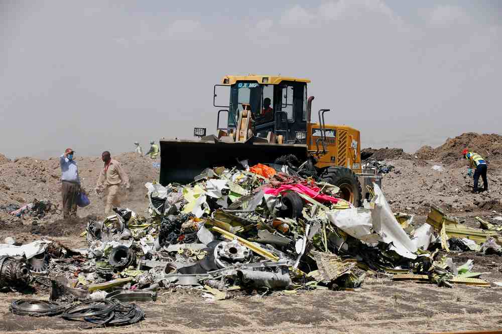 A bulldozer scopes the debris of the Ethiopian Airlines Flight ET 302 plane crash before a commemoration ceremony near the town of Bishoftu, southeast of Addis Ababa, Ethiopia March 13, 2019. u00e2u20acu201d Reuters pic