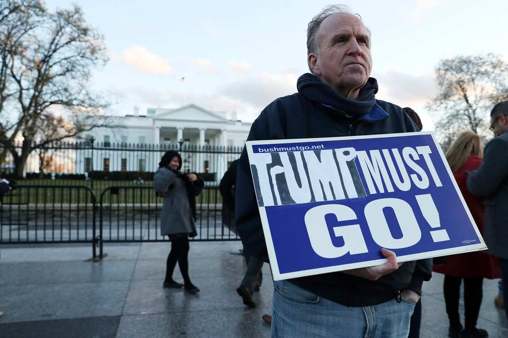 Robert Griffin protesting outside the White House with a 'Trump Must Go' sign after Special Counsel Robert Mueller handed in his Russia probe in Washington March 22, 2019. u00e2u20acu201d Reuters pic