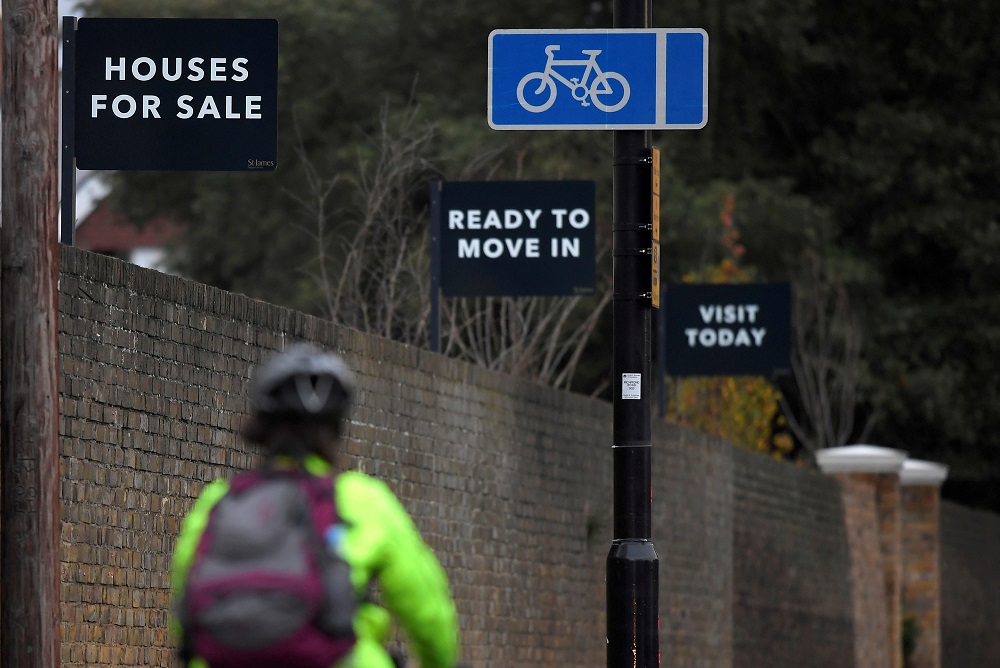 Property sale signs are seen outside of a group of newly built houses in west London November 23, 2017. u00e2u20acu201d Reuters pic     