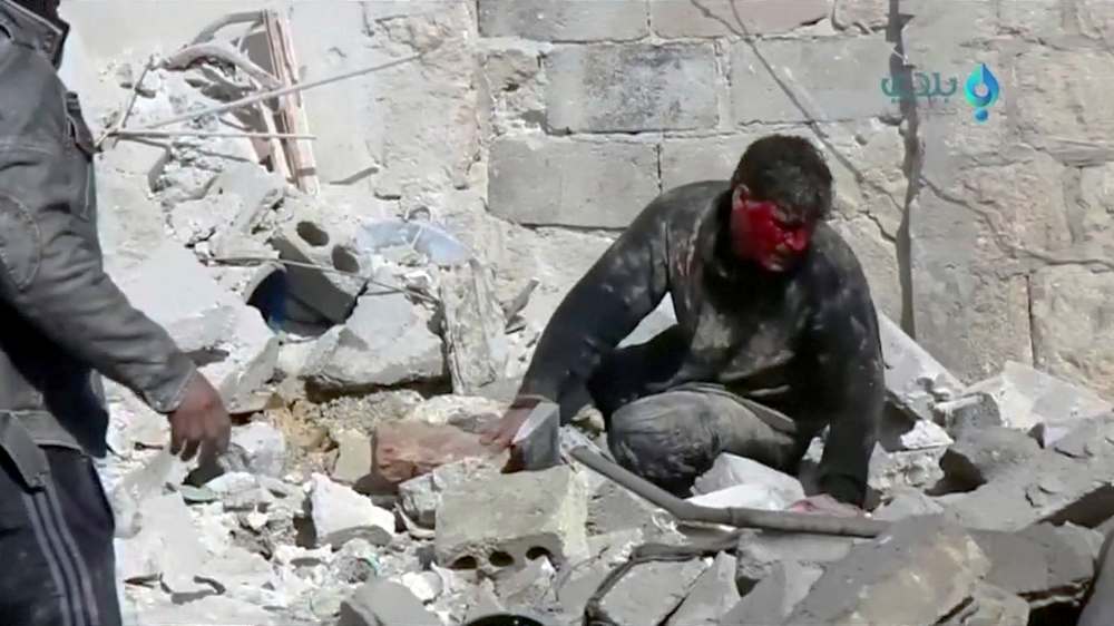 An injured man sits on rubble after an air strike on location targeted by Syrian government forces, in Khan Sheikhoun, Idlib, Syria February 26, 2019 in this video image. u00e2u20acu201d Reuters pic