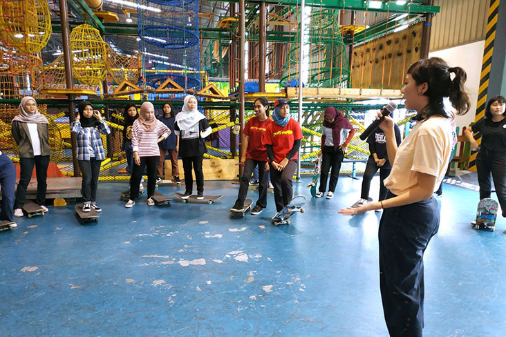Girls Jom Skate participants listening intently to their instructor.