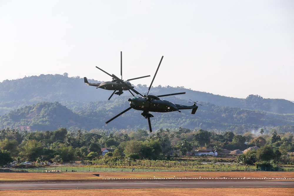 A pair of Sikorsky S-61A-4 Nuri in action during the opening of the Langkawi International Maritime and Aerospace (LIMA) Exhibition opening ceremony at Mahsuri International Exhibition Centre, Langkawi March 26, 2019. — Picture by Sayuti Zainudin