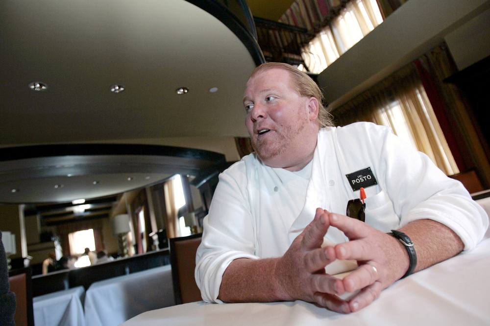Celebrity chef Mario Batali talks during an interview  at his restaurant, Del Posto, in New York April 11, 2006. u00e2u20acu201d Reuters pic