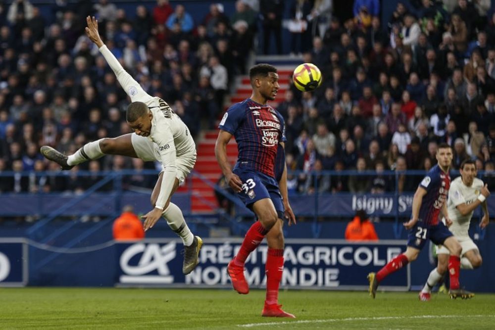 Paris Saint-Germainu00e2u20acu2122s French forward Kylian Mbappe (left) vies for the ball with Caenu00e2u20acu2122s French defender Younn Zahary during their French L1 match at the Michel du00e2u20acu2122Ornano Satdium in Caen, France, March 2, 2019. u00e2u20acu201d AFP pic