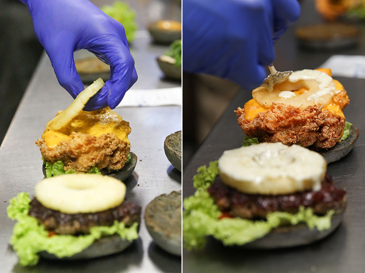 A grilled pineapple ring adds a touch of juiciness and sweetness to the whole burger (left). The blue cheese comes in the form of a dressing that is layered with the burger (right).