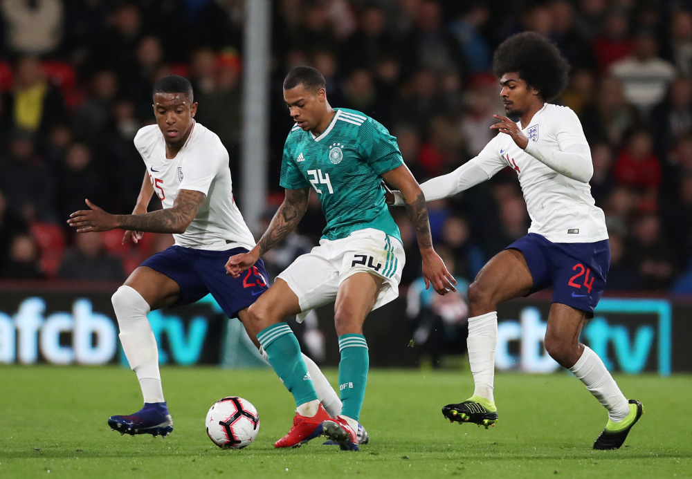 Englandu00e2u20acu2122s Ezri Konsa and Hamza Choudhury in action with Germanyu00e2u20acu2122s Lukas Nmecha during the Under 21 international friendly match at The Vitality Stadium, Bournemouth March 26, 2019. u00e2u20acu201d Picture by Peter Cziborra/Action Images via Reuters