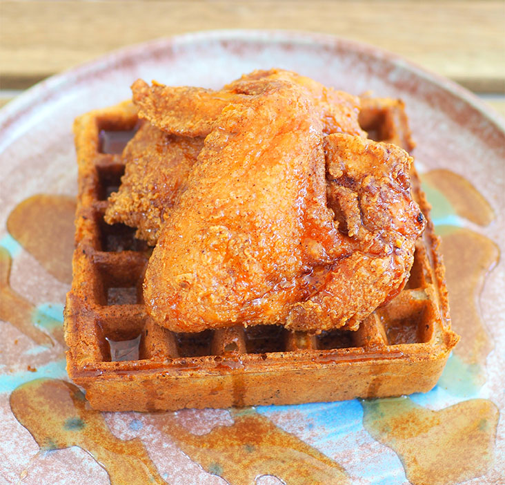 Meet The Chiffle, a divine combination of insanely good fried chicken on top of a buckwheat sourdough waffle drizzled with maple syrup.