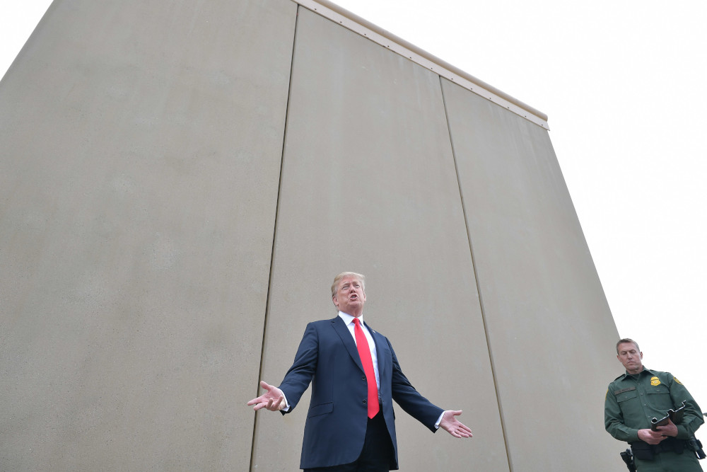 In this file photo taken March 13, 2018 US President Donald Trump inspects border wall prototypes with Chief Patrol Agent Rodney S. Scott in San Diego, California. u00e2u20acu201d AFP pic 
