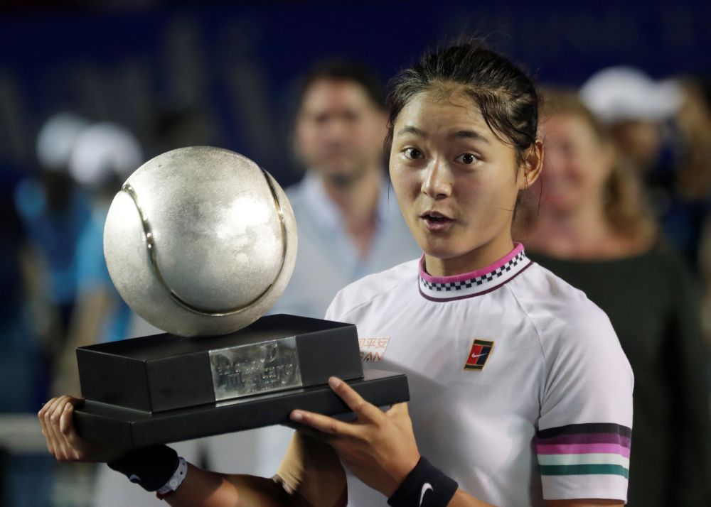 China's Wang Yafan celebrates winning the Acapulco Open with the trophy. u00e2u20acu201d Reuters pic