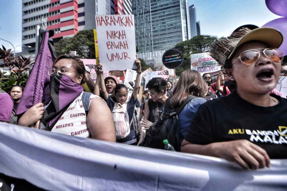 Demonstrators take part in a march in conjunction with International Women's Day in Kuala Lumpur March 9, 2018. u00e2u20acu2022 Picture by Shafwan Zaidon