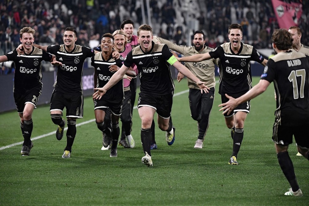 Ajaxu00e2u20acu2122s midfielder Frenkie de Jong (left) defender Matthijs de Ligt (centre) and teammates celebrate after defeating Juventus during the Uefa Champions League quarter-final second leg match in Turin April 16, 2019. u00e2u20acu201d AFP pic
