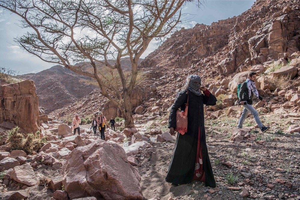Umm Yasser (2nd right), an Egyptian Bedouin woman guide from the Hamada tribe, leads a group of hikers in Wadi el-Sahu March 29, 2019, during the first ,Sinai Trail, led by Bedouin women guides. u00e2u20acu201d AFP pic