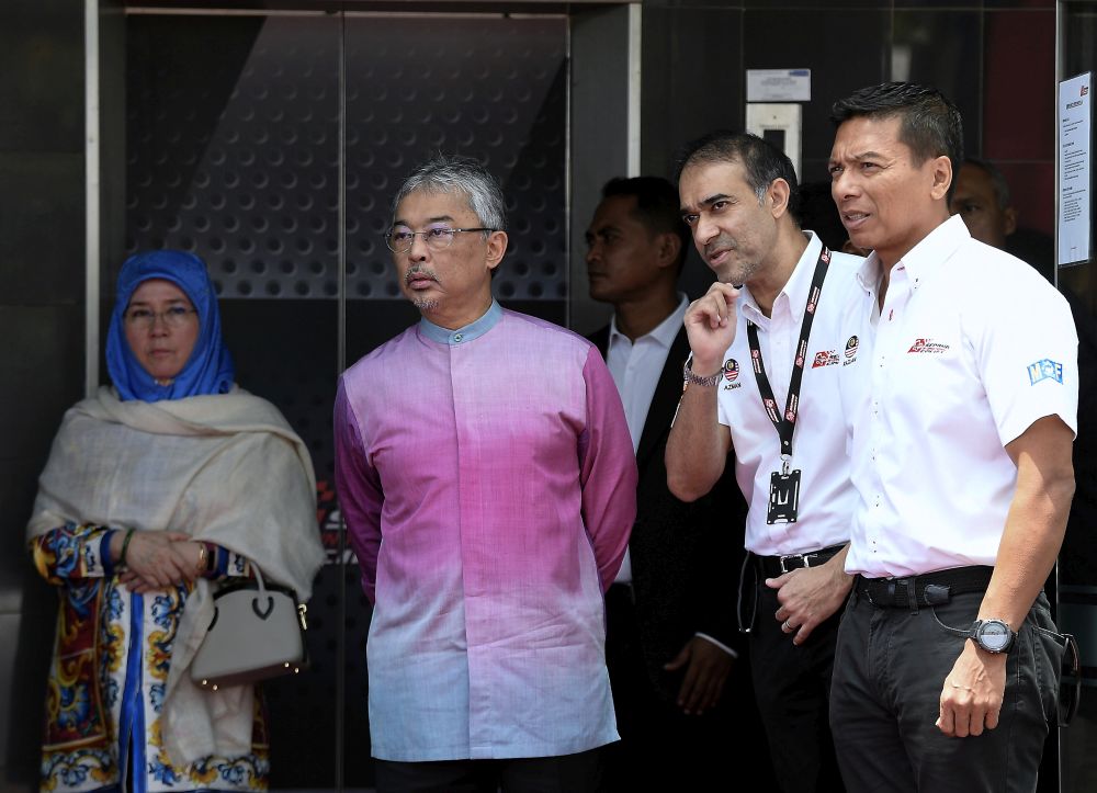 The Yang di-Pertuan Agong and Raja Pemaisuri Agong are briefed by SIC Chief Executive Datuk Razlan Razali (right) after attending the Blancpain GT World Challenge Asia 2019 race in Sepang, April 7, 2019. u00e2u20acu201d Bernama pic