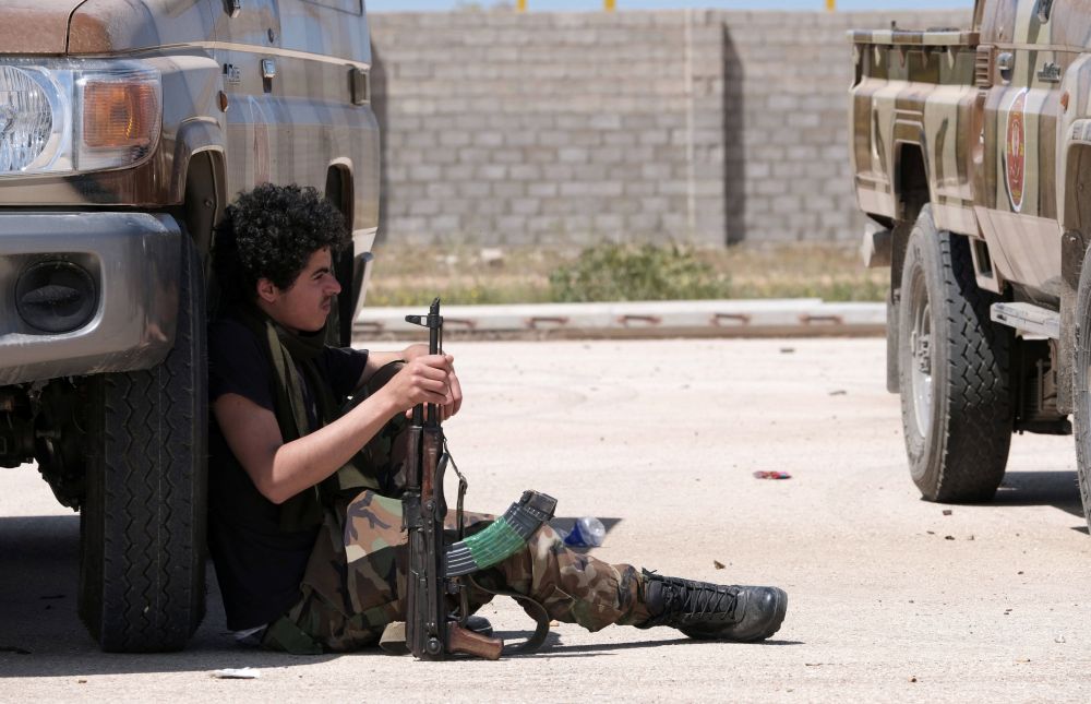 A member of Libyan National Army (LNA), commanded by Khalifa Haftar, holds his weapon as he heads out of Benghazi to reinforce the troops advancing to Tripoli, in Benghazi, Libya April 7, 2019. u00e2u20acu201d Reuters pic