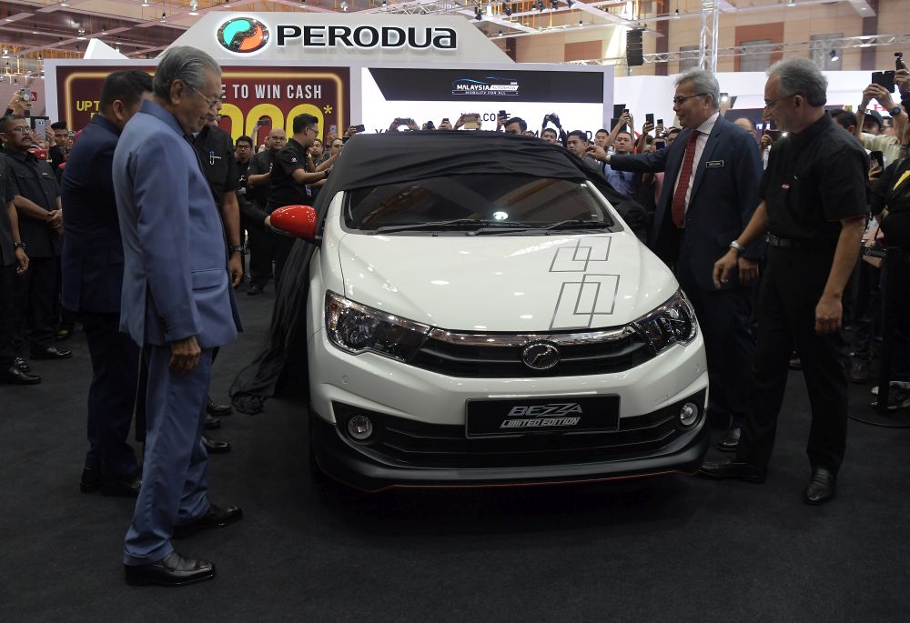Prime Minister Tun Dr Mahathir Mohamad (left) launches the Perodua Bezza Limited Edition at the Malaysia Autoshow 2019 at Taman Ekspo Pertanian Malaysia Serdang (MAEPS) April 11, 2019. u00e2u20acu201d Bernama pic