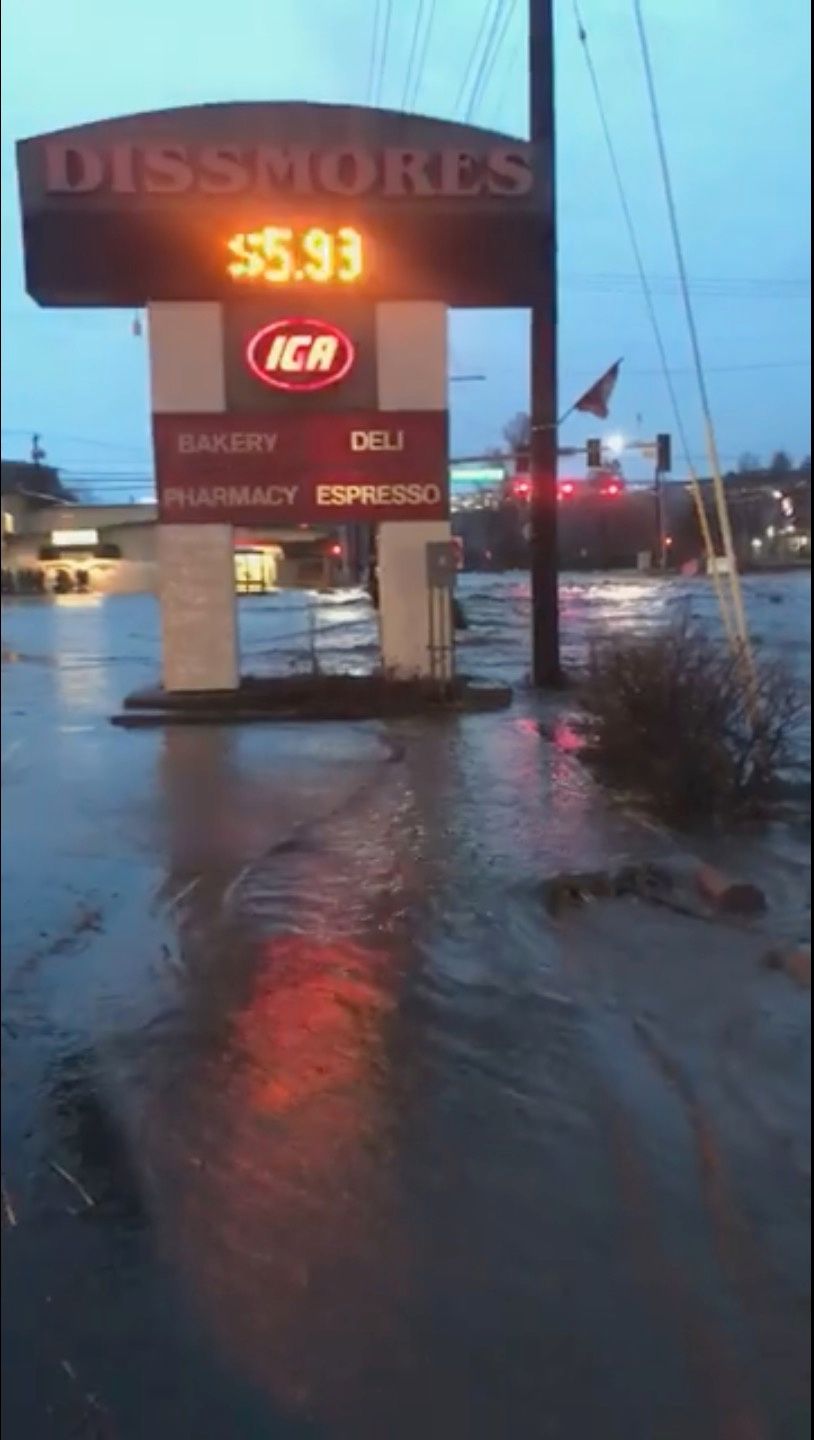 A sign for shops is seen as floodwaters flow along a street in Pullman, Washington, US in this still image taken from April 9, 2019 social media video. u00e2u20acu201d Ellie Stenberg pic via Reuters