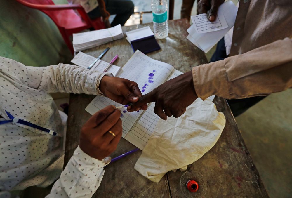 A man gets his finger inked before casting his vote at a polling station in Majuli, a large river island in the Brahmaputra river, in the northeastern Indian state of Assam, India April 11, 2019. u00e2u20acu201d Reuters pic