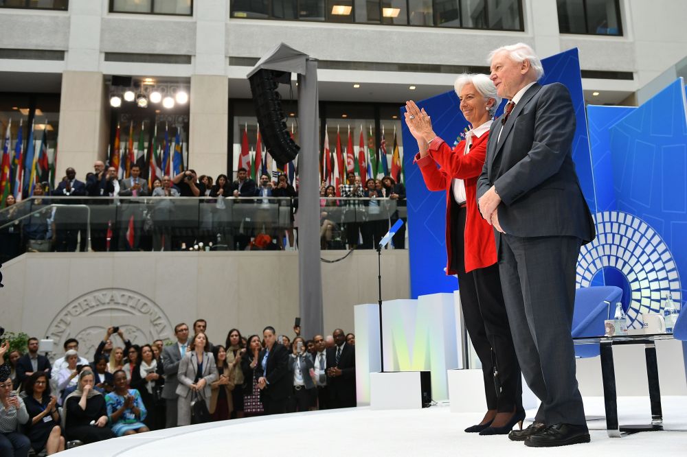 Christine Lagarde and David Attenborough stand on stage prior to their discussion on nature and the economy during the IMF-World Bank Spring Meetings at the International Monetary Fund headquarters in Washington, DC, April 11, 2019. u00e2u20acu201d AFP picn