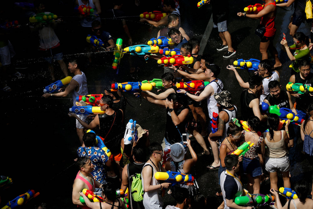 People play with water pistols during Songkran Water Festival to celebrate Thai New Year, in Bangkok April 13, 2019. u00e2u20acu201d Reuters pic