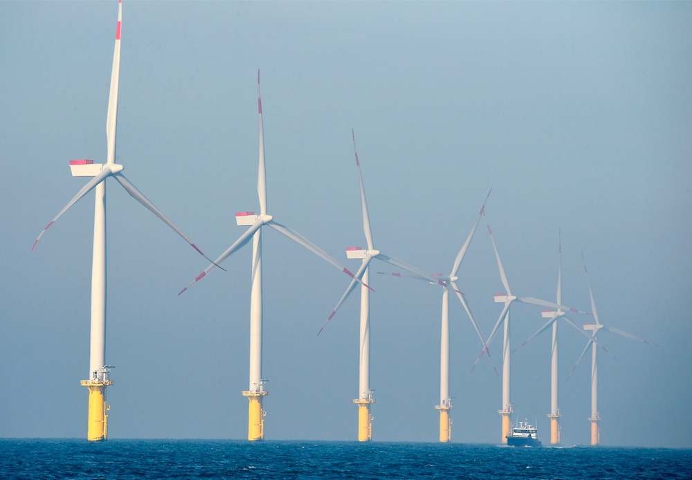 A service vessel passes by wind turbines of the German offshore wind farm u00e2u20acu02dcAmrum Bank Westu00e2u20acu2122 owned by German energy company E.ON near the Helgoland archipelago on the North Sea. u00e2u20acu201d AFP pic