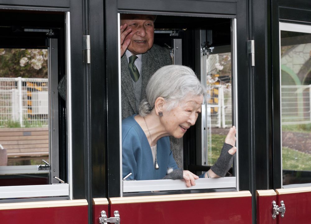 Japanu00e2u20acu2122s Emperor Akihito, top, and Empress Michiko, react to well-wishers as they visit Kodomonokuni, marking the 60th anniversary of their royal marriage, near Tokyo, April 12, 2019. u00e2u20acu201d Eugene Hoshiko /Pool pic via Reuters