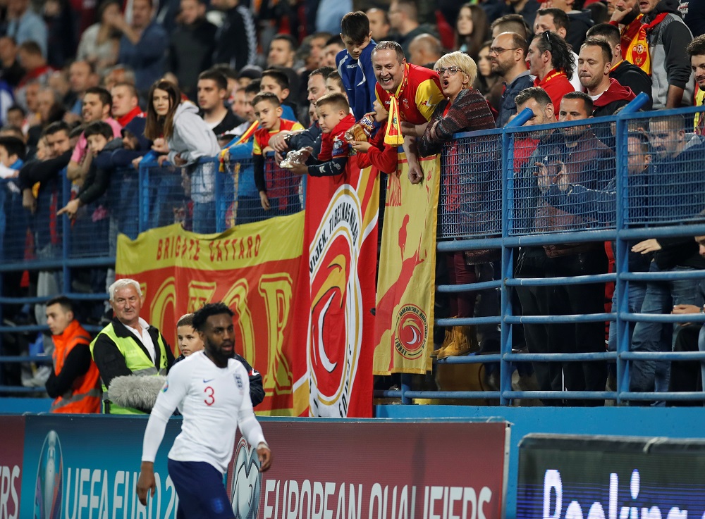 Montenegro fans and Englandu00e2u20acu2122s Danny Rose during the match at Podgorica City Stadium March 25, 2019. u00e2u20acu201d Action Images via Reuters 