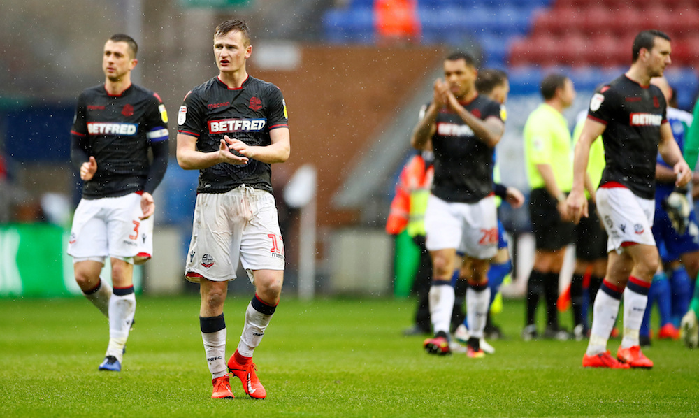 Bolton Wanderersu00e2u20acu2122 Callum Connolly applauds fans after the Championship match with Wigan Athletic at DW Stadium in Wigan March 16, 2019. u00e2u20acu201d Action Images pic via Reuters