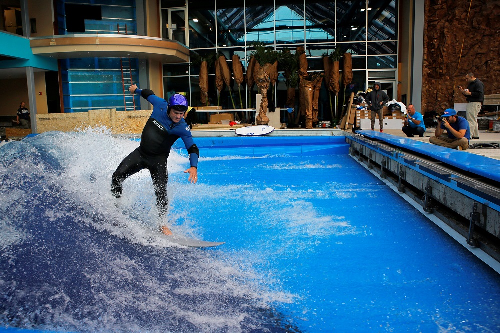 Todd Holland, former professional surfer on the world tour, tests the waves on a surfboard at the still under-construction Surfu00e2u20acu2122s Up indoor water and surf park in Nashua, New Hampshire November 15, 2013. u00e2u20acu201d Reuters pic
