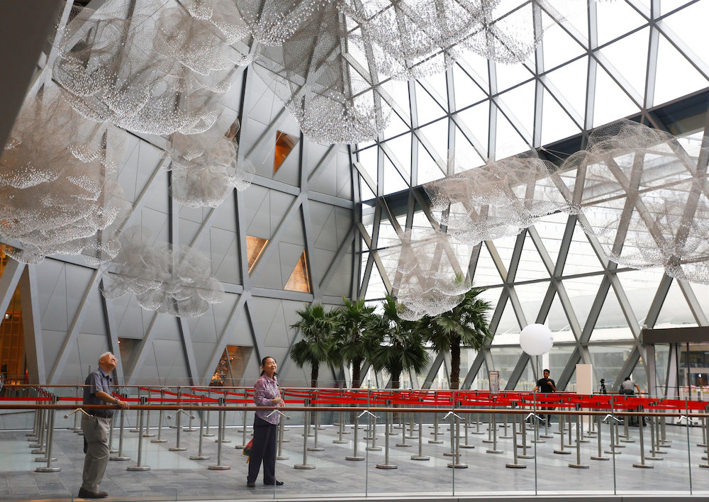 People observe an art installation inside Jewel Changi Airport in Singapore April 11, 2019. — Reuters pic