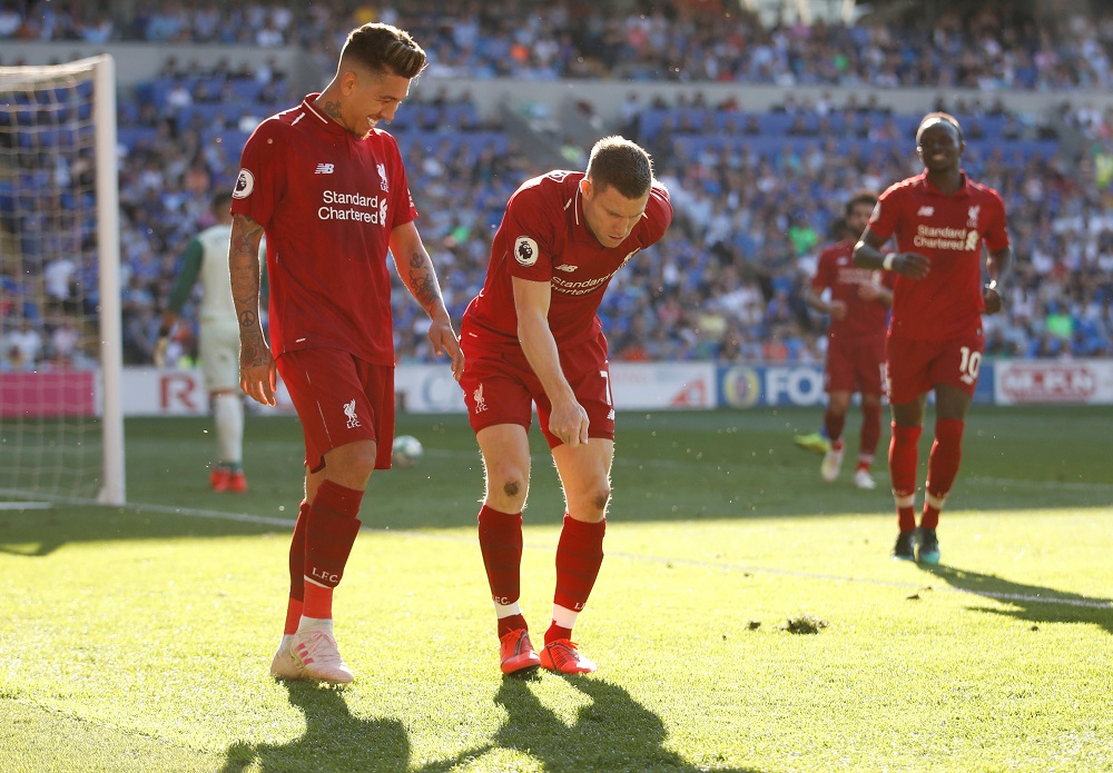 Liverpool's James Milner celebrates scoring their second goal with Roberto Firmino against Cardiff City at the Cardiff City Stadium April 21, 2019. u00e2u20acu201d Action Images via Reuters