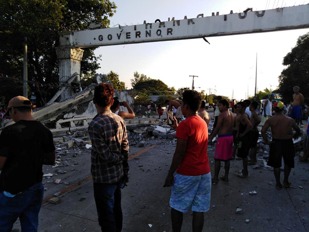 People gather near debris which collapsed and blocked a road after a quake hit Pampanga province, in the Philippines April 22, 2019, in this photo obtained from social media. u00e2u20acu201d Reuters pic