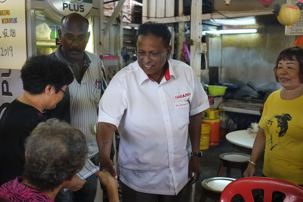 Pakatan Harapan candidate for the Rantau by-election, Dr S. Streram, greets people during a walkabout in Kuala Sawah in Rantau April 1, 2019. u00e2u20acu201d Picture by Yusof Mat Isa