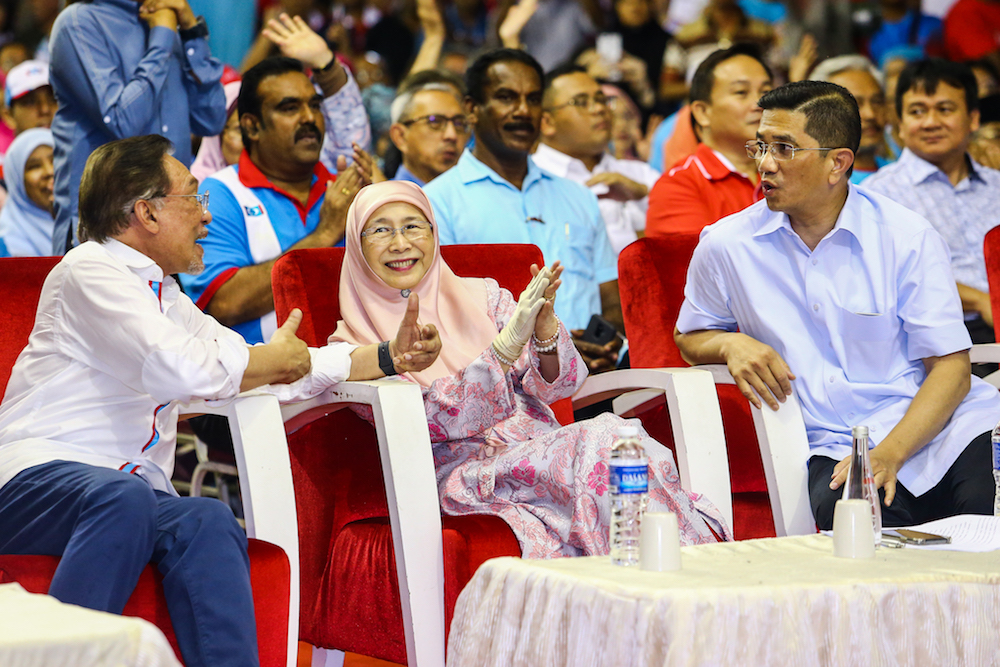 Datuk Seri Anwar Ibrahim, Datuk Seri Dr Wan Azizah Wan Ismail and Datuk Seri Azmin Ali attend PKRu00e2u20acu2122s 20th anniversary celebrations at Dataran Rantau, Negri Sembilan April 4, 2019. u00e2u20acu201d Picture by Hari Anggara