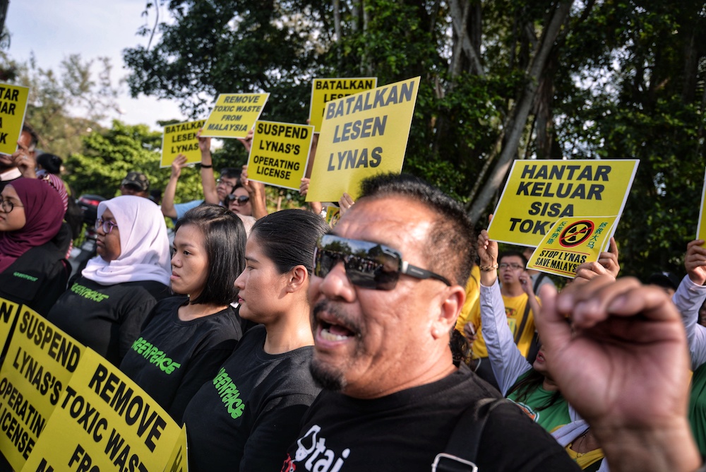 Anti-Lynas demonstrators rally in front of Parliament compound in Kuala Lumpur April 10, 2019. Lynas claims that for a good year after GE14, there has been a campaign of misinformation by anti-Lynas activists. — Picture by Shafwan Zaidon