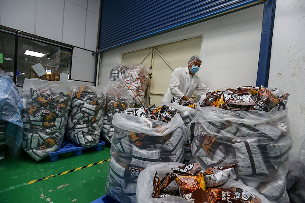 Workers pack goods at a local SME company in Simpang Ampat, Penang April 11, 2019. u00e2u20acu201d Picture by Sayuti Zainudin