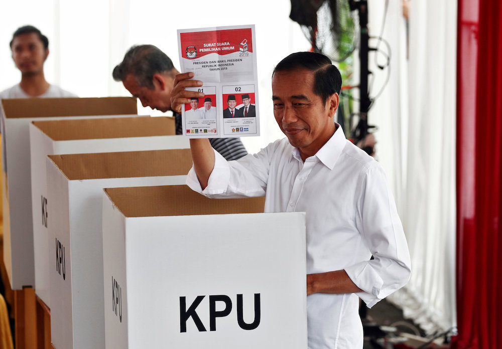 Indonesian President Joko Widodo casts his ballot during elections in Jakarta, Indonesia April 17, 2019. u00e2u20acu201d Reuters pic