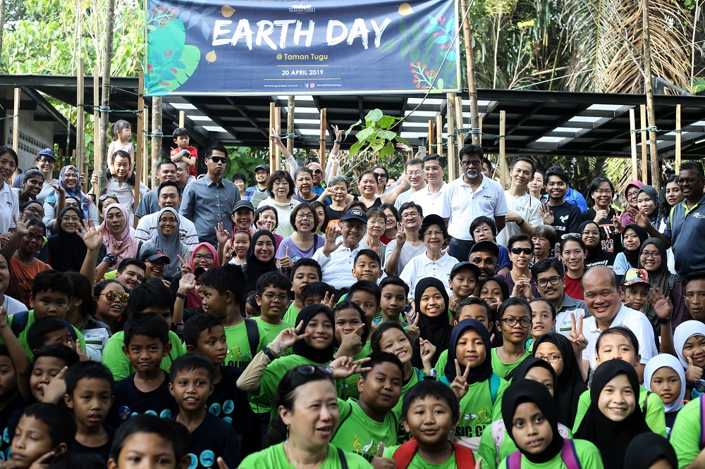 Prime Minister Tun Dr Mahathir Mohamad and Tun Dr Siti Hasmah pose for a group picture with attendees at the Earth Day celebration at Taman Tugu Nursery in Kuala Lumpur April 20,2019. 
