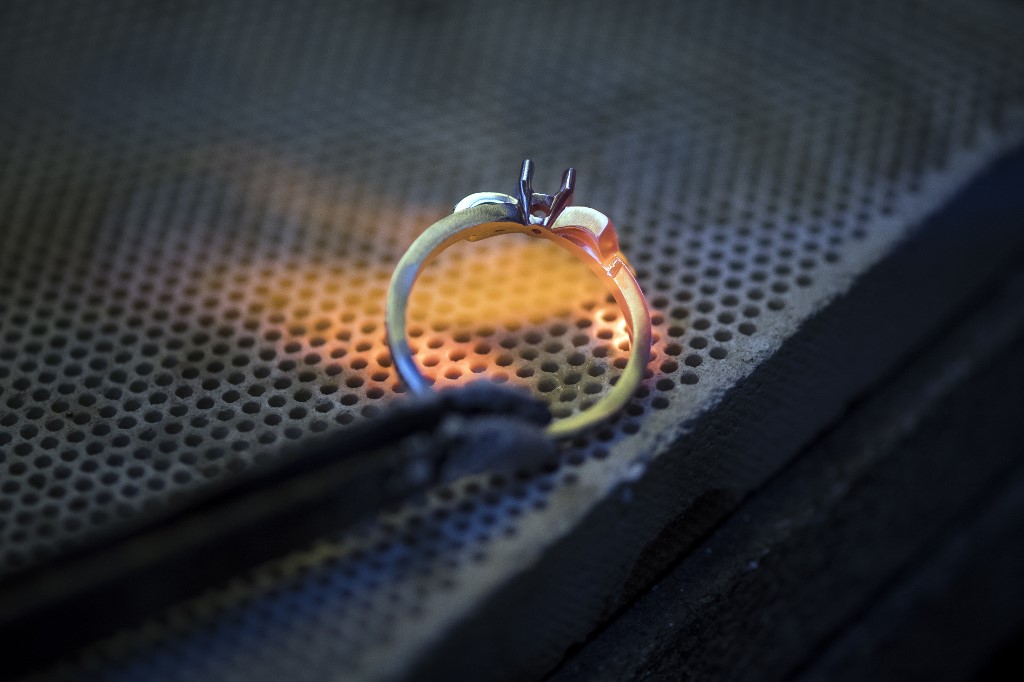 A jeweller works on a ring in an ethical gold jewellery workshop in Paris on February 18, 2019. u00e2u20acu201d AFP picnn