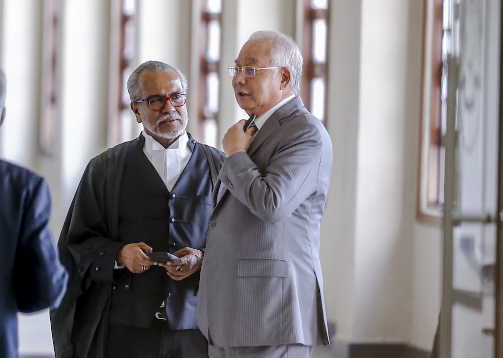 Datuk Seri Najib Razak speaks to Tan Sri Muhammad Shafee Abdullah at the Kuala Lumpur Court Complex April 22, 2019. u00e2u20acu201d Picture by Firdaus Latif
