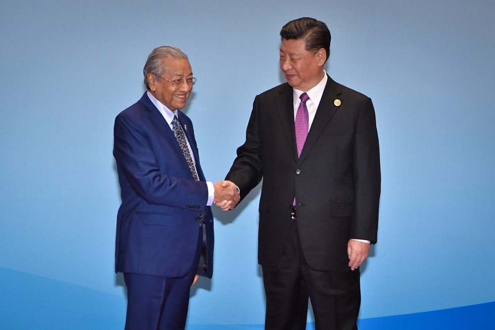 Prime Minister Tun Dr Mahathir Mohamad is greeted by China President Xi Jinping upon his arrival at the Yangi Lake Complex in Beijing April 27, 2019. u00e2u20acu201d Bernama pic