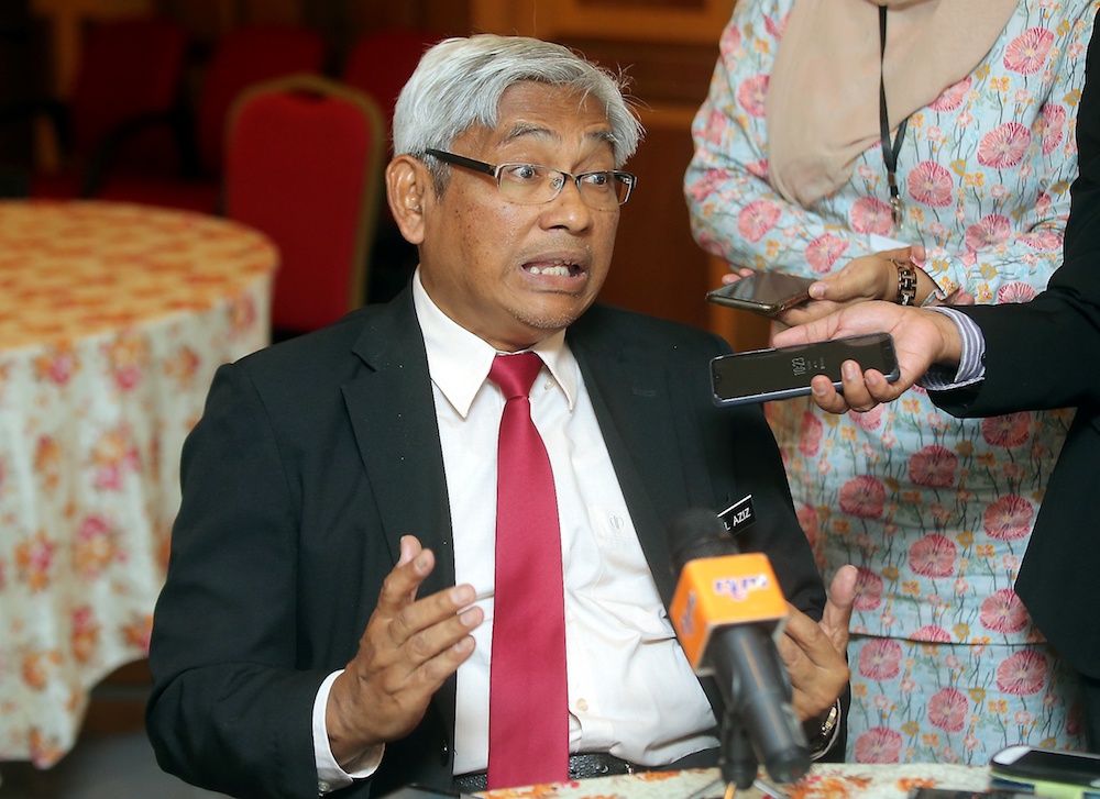 Perak DAP vice-chairman Abdul Aziz Bari speaks to reporters in Ipoh April 23, 2019. u00e2u20acu201d Picture by Farhan Najib