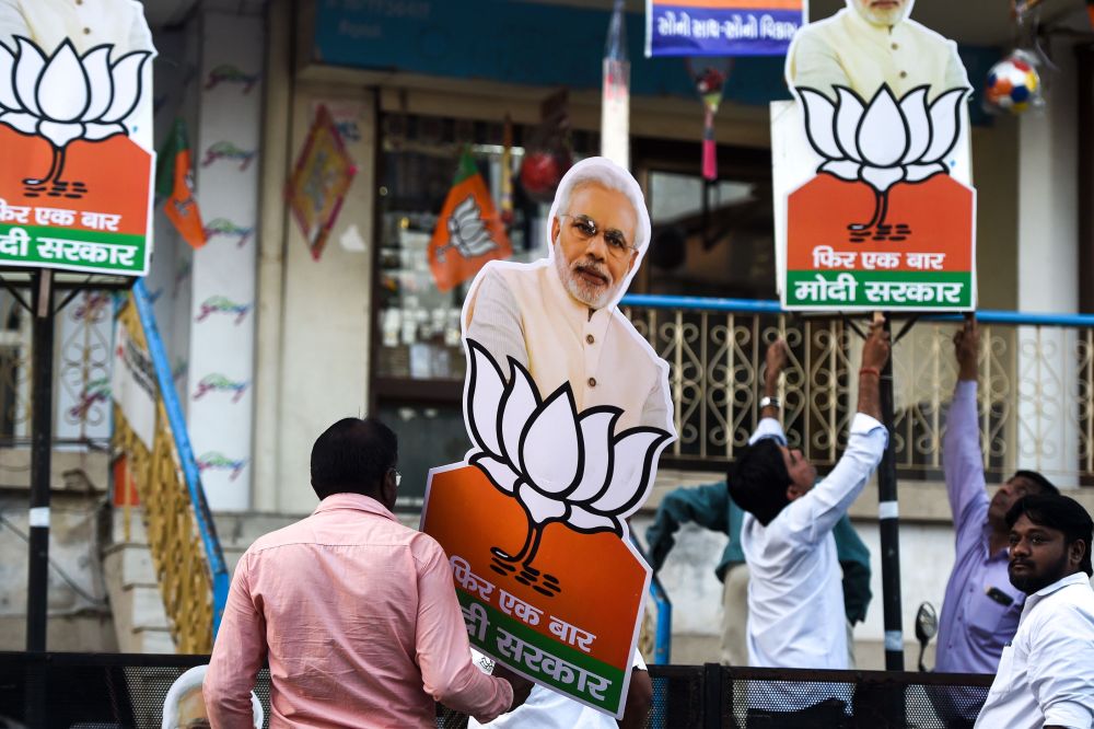Indian residents put up posters of Prime Minister Narendra Modi on their house in Ahmedabad April 22, 2019, the day before the third phase of Indiau00e2u20acu2122s general election. u00e2u20acu201d AFP pic