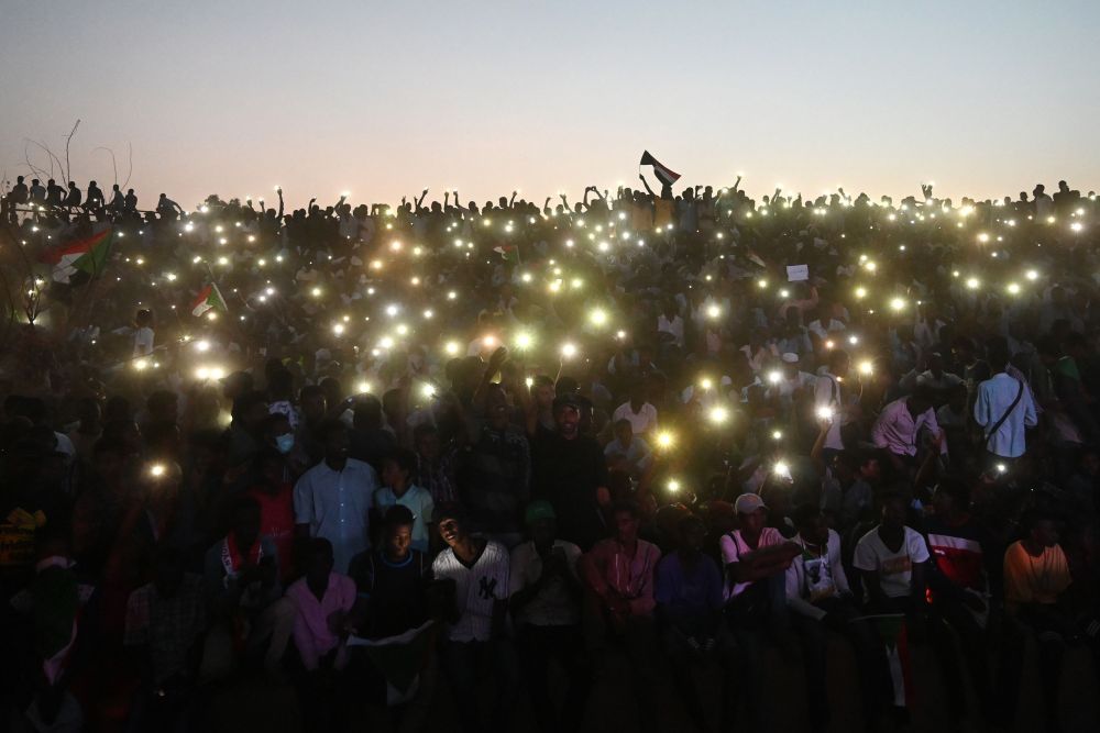 Sudanese protesters open their smartphones lights as they gather for a u00e2u20acu02dcmillion-strongu00e2u20acu2122 march outside the army headquarters in the capital Khartoum April 25, 2019. u00e2u20acu201d AFP pic