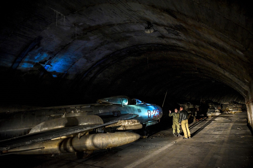 Albanian military personnel walk next to MIG-19 jet fighters inside the main tunnel of the Gjader Air Base built near the city of Lezhe February 5, 2019. u00e2u20acu201d AFP pic 