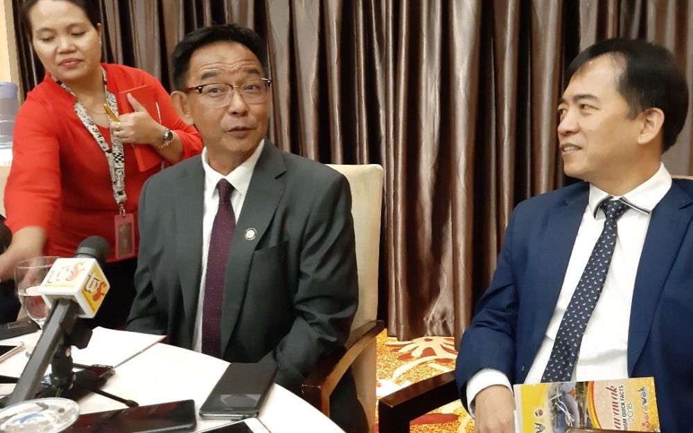 Tourism Minister Datuk Abdul Karim Rahman Hamzah (left) with the ministryu00e2u20acu2122s permanent secretary Hii Chang Kee April 3, 2019.u00e2u20acu201d Picture by Sulok Tawie