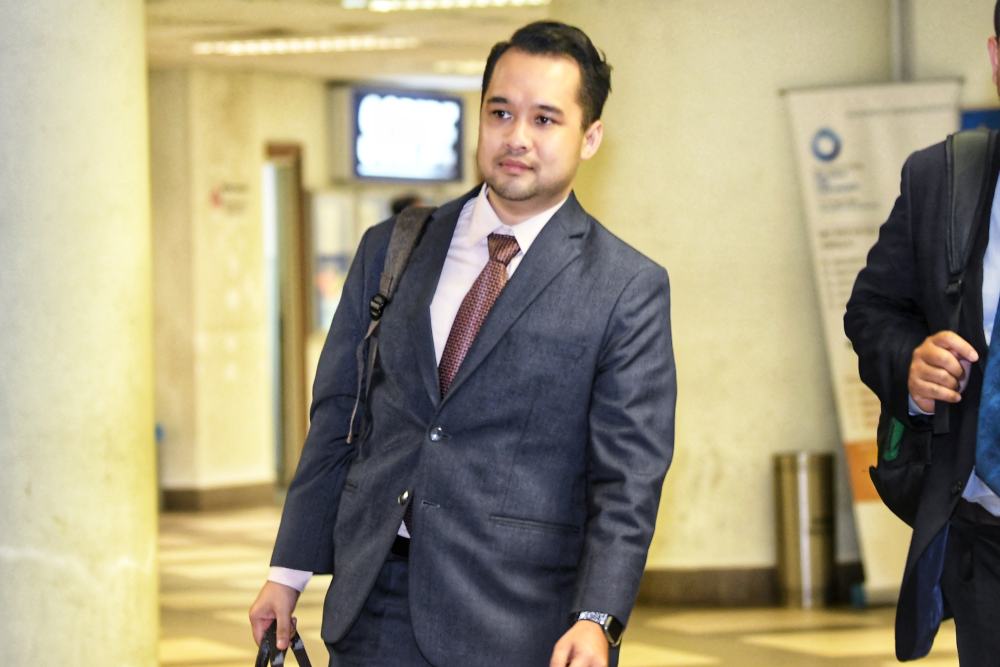 Bank Negara Malaysia manager Ahmad Farhan Sharifuddin is seen at the Kuala Lumpur Courts Complex in Kuala Lumpur April 17, 2019. u00e2u20acu2022 Picture by Shafwan Zaidon