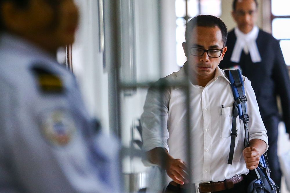 BNM manager Azizul Adzani Abdul Ghafar arrives at the High Court in Kuala Lumpur April 15, 2019. u00e2u20acu201d Picture by Hari Anggara