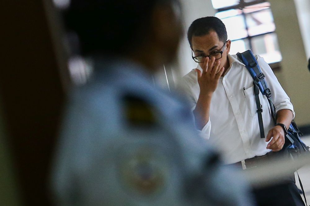 BNM manager Azizul Adzani Abdul Ghafar arrives at the High Court in Kuala Lumpur April 15, 2019. u00e2u20acu201d Picture by Hari Anggara