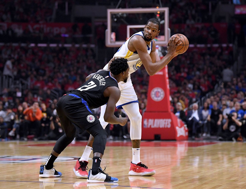 Kevin Durant (35) of the Golden State Warriors is guarded by Patrick Beverley (21) of the LA Clippers during Game Two of Round One of the 2019 NBA Playoffs in Los Angeles April 18, 2019. u00e2u20acu201d AFP pic