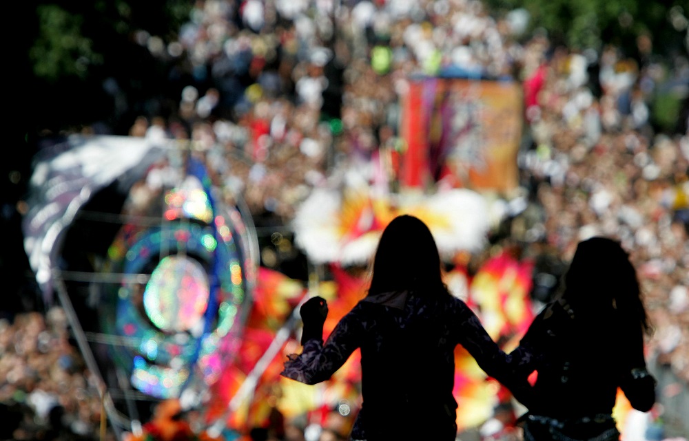 Two women are silhouetted as revellers fill the streets of Londonu00e2u20acu2122s Notting Hill during the annual carnival, August 29, 2005. u00e2u20acu201d Reuters pic       